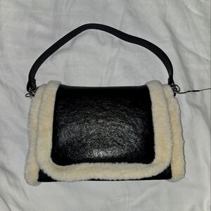 BCBGeneration Black and Cream Plush Trim Shoulder Bag